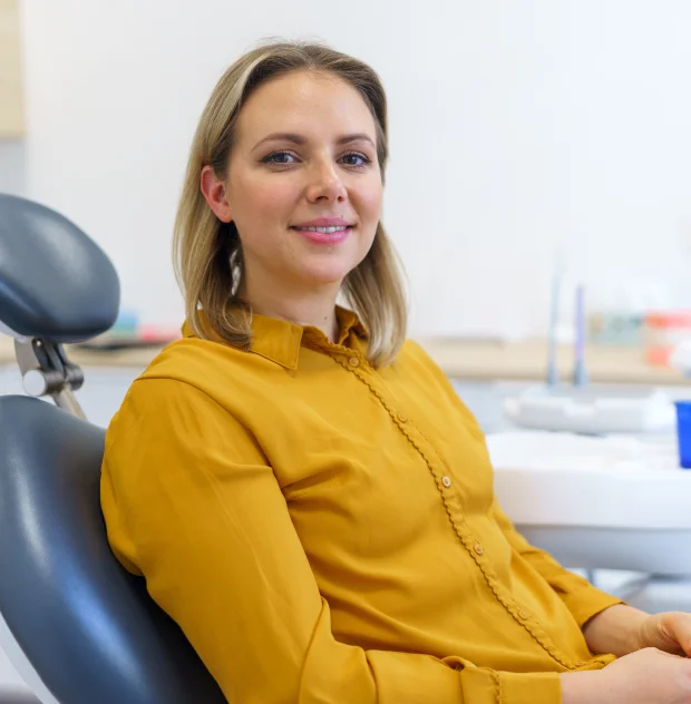 Woman sitting in dental treatment chair